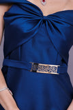 Close-of-shoulder evening dress with bow, turquoise color