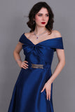 Close-of-shoulder evening dress with bow, turquoise color