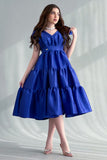 Mid-length dress with layers and a bow on the shoulder, blue