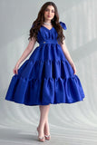 Mid-length dress with layers and a bow on the shoulder, blue