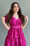 Mid-length dress with layers and a bow on the shoulder, fuchsia color