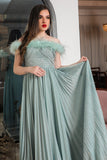 Tiffany color evening dress decorated with feathers