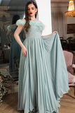 Tiffany color evening dress decorated with feathers