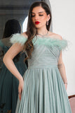 Tiffany color evening dress decorated with feathers