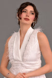 Evening dress with a folded collar and decorated with white feathers