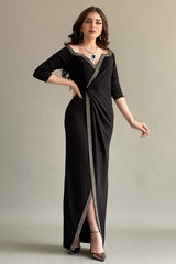 Black jersey wrap dress decorated with a crystal ribbon