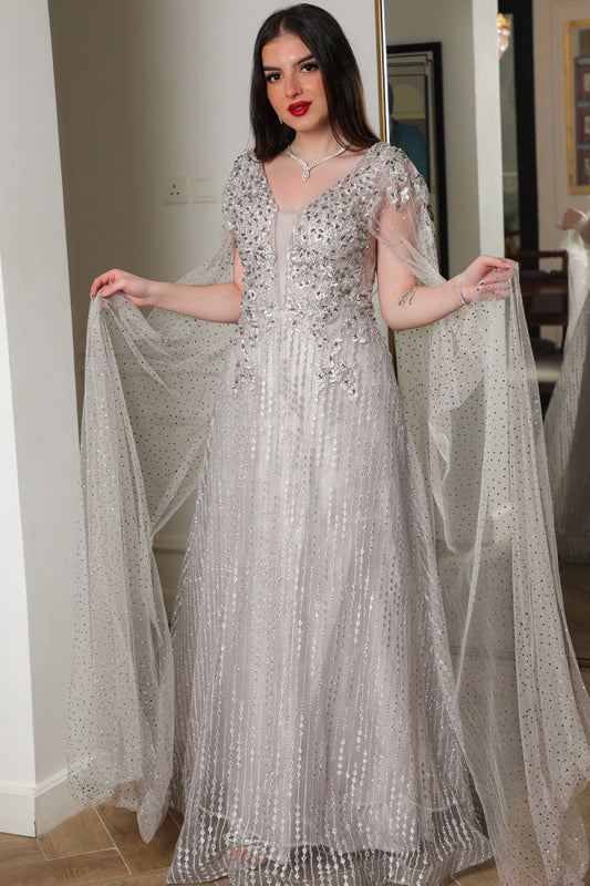 Gray embroidered tulle evening dress with a cape design