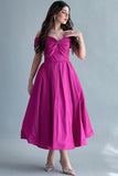 Off-shoulder evening dress with a fuchsia bow