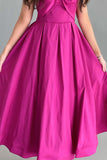 Off-shoulder evening dress with a fuchsia bow