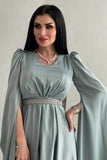 Asymmetric dress with cape sleeves in Tiffany