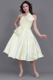 Short evening dress with embroidered bow, yellow