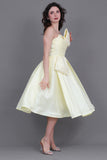 Short evening dress with embroidered bow, yellow