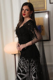 Black embroidered evening dress with cape sleeves