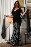 Black embroidered evening dress with cape sleeves