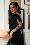 Black embroidered evening dress with cape sleeves