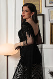 Black embroidered evening dress with cape sleeves