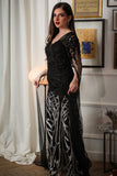 Black embroidered evening dress with cape sleeves