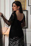 Black embroidered evening dress with cape sleeves