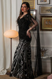 Black embroidered evening dress with cape sleeves