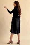 Short, V-neck dress with long sleeves and a slanted button line