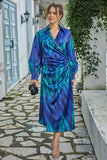 Midi dress with a tie at the waist, decorated with fringes and crystals, blue color