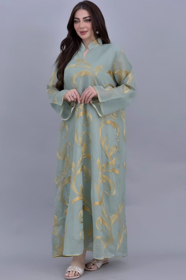 Oriental galabiya embroidered with a golden and green veil