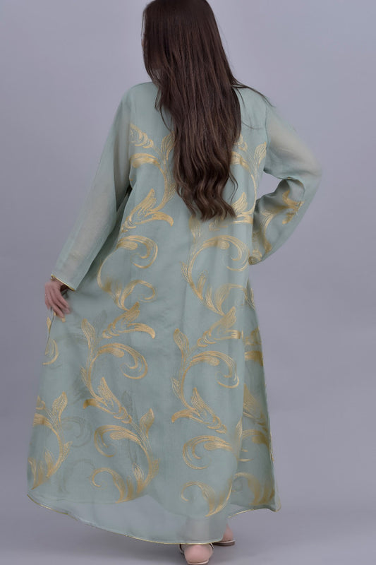 Oriental galabiya embroidered with a golden and green veil