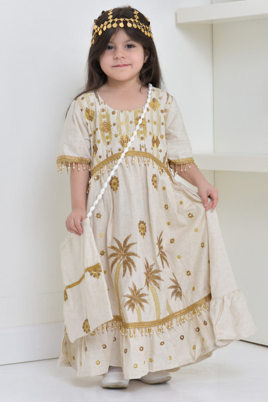 Linen jalabiya with palm embroidery and decorated with beads and lulu 