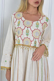 Jalabiya with embroidered lines and colorful patterns, decorated with beads and pearls