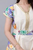 Shantoon robe embroidered with colorful geometric patterns in sugar colour 