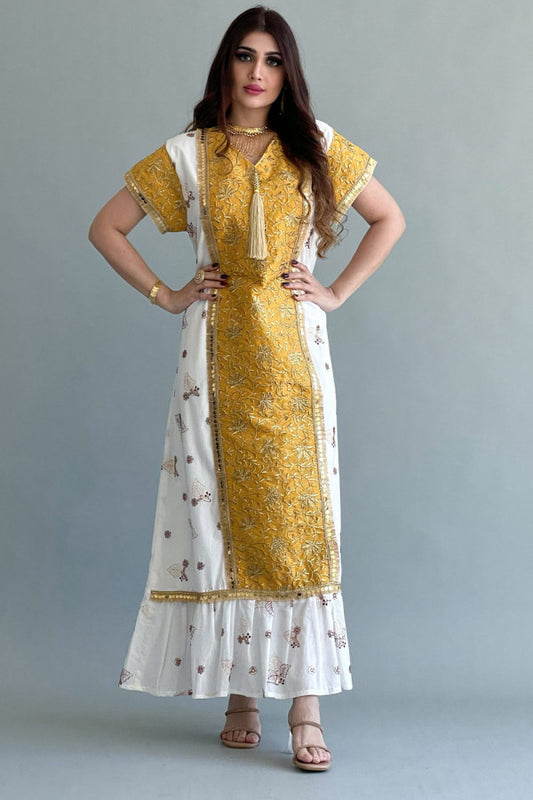 Embroidered galabiya decorated with yellow tassels