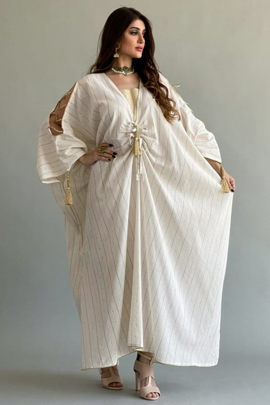 A striped bisht galabiya decorated with a golden, sugar-coloured qitan 