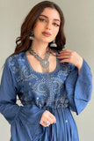 An elegant jalabiya, embroidered and ruffled at the ends, in blue colour