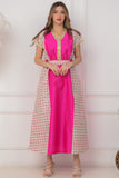 Oriental galabiya with embroidered sides and a fuchsia belt 