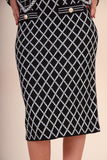 An elegant skirt and blouse set with an interlocking rhombus print
