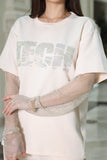 A set of trousers and a blouse decorated with a sugar-colored mesh 