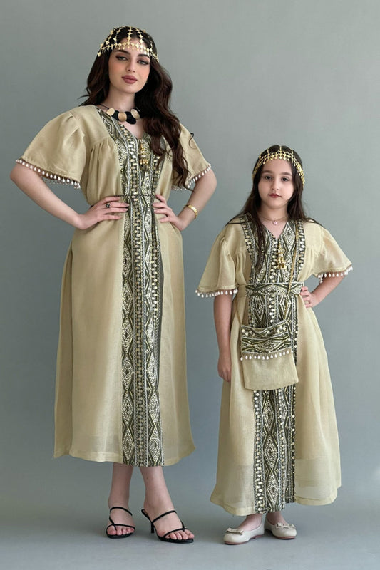Kuwaiti jalabiya with vertical embroidery and decorated with Lulu tassels, beige colour