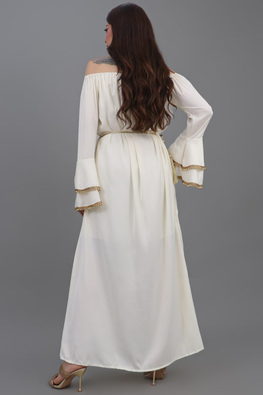 A soft oriental galabiya with ruffles sleeves decorated with golden crystals in a sugar colour