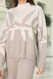 A winter set of pants and a blouse with a wide design, beige 