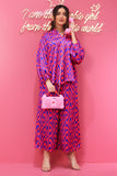 Wide-leg trousers and top set in fuchsia colour