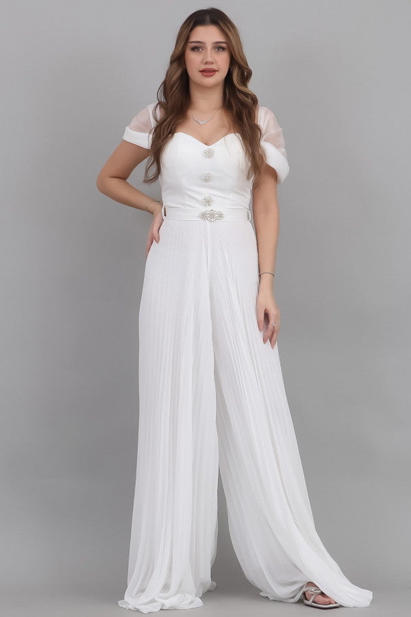 White jumpsuit with a wide design, decorated with a crystal brooch