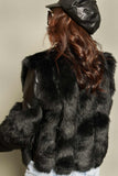 A sophisticated mix jacket made of leather and fur