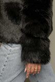 A sophisticated mix jacket made of leather and fur
