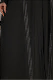 Black abaya decorated with a crystal ribbon