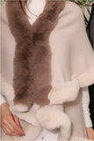 Sweater shawl decorated with faux fur 