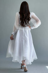 Cloche dress decorated with feathers and a lulu on the chest, white