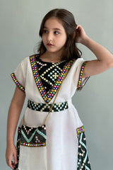 Kuwaiti girls' jalabiya with embroidered sides, sugar color with dark green