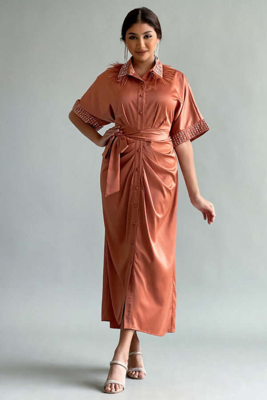 Pleated shirt dress decorated with crystals and orange feathers