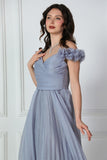 Gray evening dress with ruffle sleeves