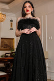 Top evening dress decorated with black tricot